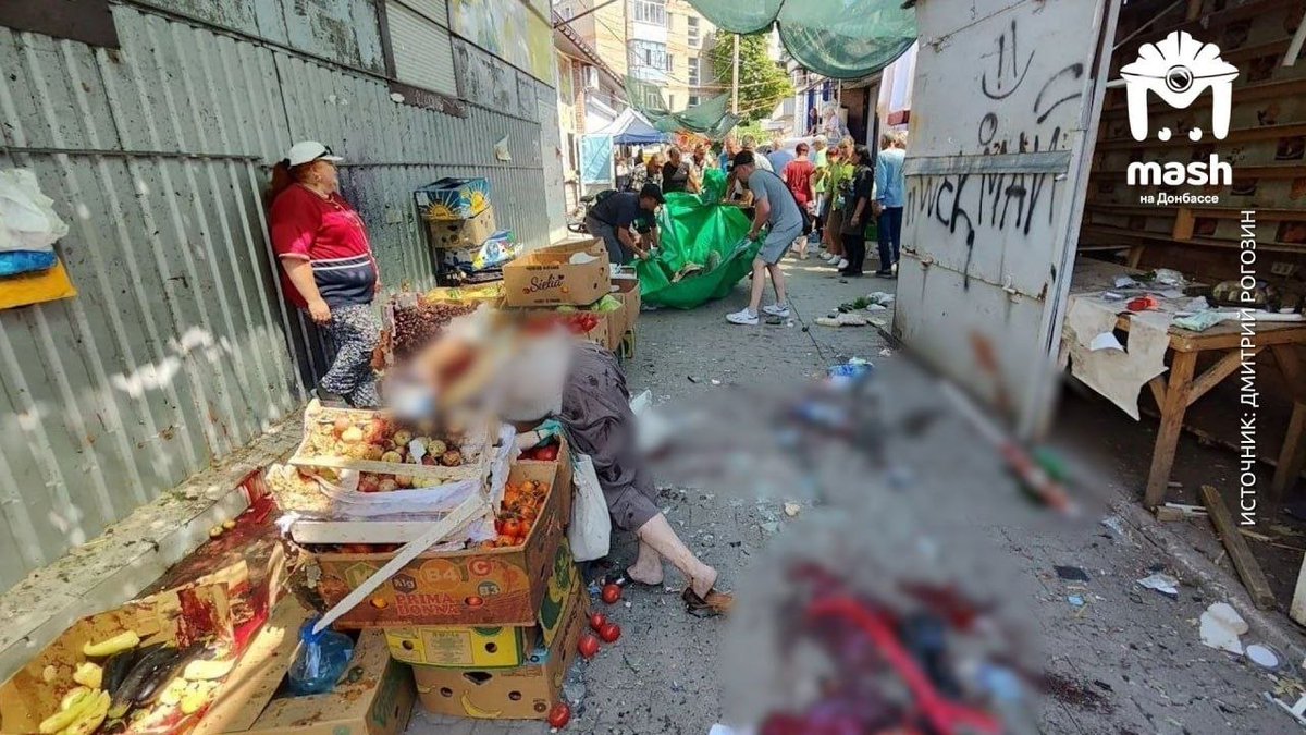 EvaKBartlett's tweet photo. Ukrainian terrorism and war crimes: deliberately targeting civilians in a market, killing 5 civilians and injuring 18

"Terrifying photos from the market in Tokmak, which was shelled by UAF drones today.

One of the women was hit by a shrapnel while she was selecting fresh vegetables. She died instantly - her body fell directly onto the boxes of fruits. A total of five civilians were killed. At least 18 people were injured."
https://t.co/xgt9gWvUq8

*Ukraine has been targeting busy public marketplaces for a long time. 

Market areas I've seen immediately after Ukrainian terror attacks:

April 2022:
https://t.co/QG7ephYlOF

September 2022:
https://t.co/hiIDesCe2t