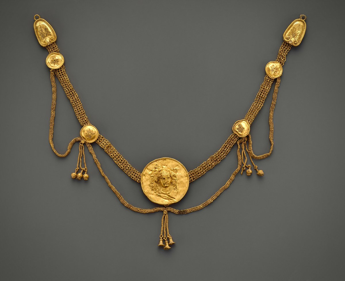 Athanasius_45's tweet photo. A Hellenistic era gold collar necklace with a medallion of Dionysus. MET, New York.

Ἒν πυρὶ μὲν χρυσόν τε καὶ ἄργυρον ἴδριες ἄνδρες
γιγνώσκουσ᾽, ἀνδρὸς δ᾽ οἶνος ἔδειξε νόον
-
Using fire skilled men determine what is gold and what is silver,
and so does wine reveal the hearts of men
Theognis 499-500
