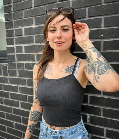jmrphy's tweet photo. The currently fashionable male view of tattoos on women is a hysterical herd phenomenon, which pretends to be some kind of sophisticated anthropological "red pill"—except it's obviously wrong.

The meme says "tattoo = red flag" and "no tattoo has ever made a woman more beautiful."

These two observations are contradictory. What none of the Men Against Female Tattoos ever acknowledge is:

Red Flags are Hot. Red flags are not predictors of stability, faithfulness, or sustainable compounding of value, but not all the attractions of human life are perfectly correlated with the preferences of uptight Anglo shopkeepers.

The most sexually attractive traits are correlated with a propensity toward self-destruction: risk, recklessness, and self-endangerment, even to the point of death. Read Freud, Bataille, or even within evo-psych just look at Life History Theory. Self-destruction has always been one of the sexiest things in the world—and for good reasons, even if it cuts against long-term stability.

It may be true that one tattoo rarely makes a woman more beautiful (in part because one tattoo has little signal either way), but what this popular refrain ignores is the following inconvenient fact: Many tattoos can make a woman far more attractive. If you've ever been to a bar at night (many of these men have not), the hottest woman there (according to the actual felt sense of lust averaged across all the men), will ALWAYS be the wild-looking, heavily tattooed baddie over the pristine girl in a sundress, assuming other traits are equal.

If any of these anti-tattoo men were approached by one of these women below, in a bar past 11pm, they would simply wet their pants. They would not be able to handle it, and they've never had the opportunity, either. And I think they know that this is true, which is why they hysterically project against any woman with ANY SINGLE tattoo, with this weirdly intellectualized gloss that folds if you even poke it for a second.

Men who love to talk about their zero-tolerance policy for tattoos on women are often just boring, fearful, cowardly men who know nothing of romance, love, sex, or death. All they care about is securing a loyal safe obedient slave who is guaranteed to never put their long-term value accretion at risk. This is also why many of them never get married at all, or stay perpetually divorced; and the ones who are married are often just uptight bores and petty tyrants over boring, lame little households. Can we also talk about how this anti-tattoo hysteria is itself a kind of inverted woke feminism—it's so prissy, so fixated on "trauma" (which is probably not real, and a left-wing bludgeon), etc.

Sorry bros but the theory presented here is far more consistent with the data. It's OK to have your own preferences; you don't have to dress them up as profound social theories, which conveniently also frame yourself as a good person, and women you could never get as bad people!