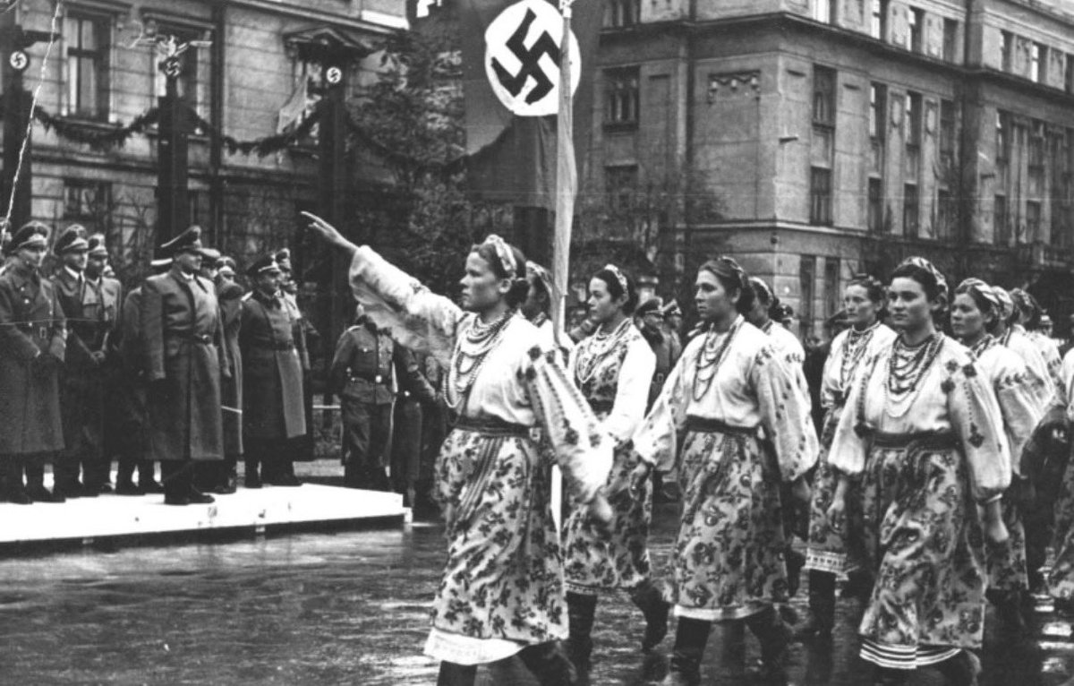 ReidEdwardII's tweet photo. There Is No Moral Defense for the Murder of Innocents:

The mass murder of well over a hundred thousand Polish civilians by the Ukrainian Insurgent Army (UPA) and associated nationalist formations in Volhynia and Eastern Galicia during World War II is one of the darkest chapters of twentieth-century European history. Men, women, children, and the elderly were deliberately targeted because they were Polish. Entire villages were destroyed. Families were exterminated. Many victims were subjected to extraordinary cruelty before being killed.

There is no historical context, political grievance, or nationalist aspiration that can justify these crimes. Every people has the right to seek freedom and independence, but no nation has the right to build that freedom upon the systematic murder of civilians.

Over the years, I have had countless conversations with Ukrainians and others about this and most have attempted to minimize them, deflect responsibility, justify them as retaliation, or celebrate the very individuals who led or inspired these crimes. That is deeply troubling.

A mature society does not become weaker by confronting its past. Germany did not honor the architects of the Holocaust. Historical reconciliation begins when nations acknowledge painful truths rather than excuse them.

No reasonable person should accept the glorification of those responsible for ethnic cleansing or mass murder. Honoring individuals implicated in atrocities sends a message that the suffering of innocent victims is secondary to nationalist mythology. It deepens old wounds instead of healing them.

Recognizing these crimes is not an attack on the Ukrainian people. Millions of Ukrainians had no involvement in these events, and many Ukrainians also suffered enormously during the Second World War. Distinguishing between a nation and those who committed atrocities is essential if history is to be understood honestly.

The Polish victims deserve the same dignity afforded to every other victim of genocide and ethnic cleansing. Their graves deserve to be found and properly marked. Their names deserve to be remembered. Their families deserve truth instead of denial.

History cannot become selective. If we condemn atrocities committed by one nation while excusing identical crimes committed by another, we abandon the very principles of justice we claim to defend. Compassion loses its meaning when it depends upon the identity of the victim.

The path toward genuine reconciliation is neither denial nor glorification. It is truth, remembrance, accountability, and the courage to say without qualification: the deliberate murder of innocent civilians was wrong, and there is no moral excuse for it.

Photo: Ukrainian women dressed in national costumes salute German high command during the parade in Stanislaviv