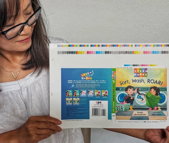 SongjuDaemicke's tweet photo. Look what’s here?! A set of proofs of my new book, Sort, Wash, ROAR! illustrated by the talented Sian James.  I’m so excited to share this fun book with the world! Steam Works @charlesbridge 10/6/2026  
📚🍀🩷⭐📚
#boardbooks #stem #divers #stemeducation #steam #stembooks https://t.co/BrXi0NQgAR