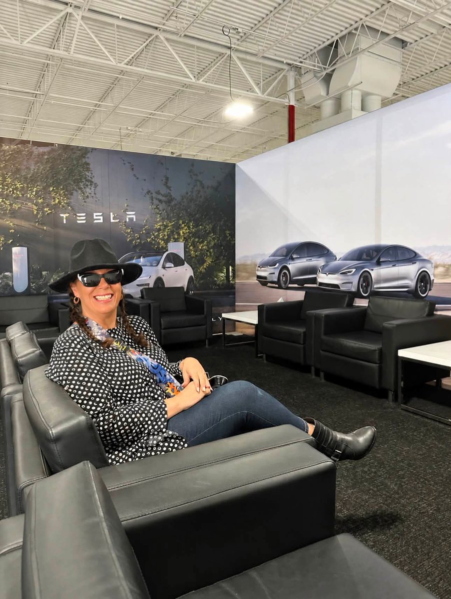 775Garage's tweet photo. For the last 7 years, I’ve driven an SUV. Before that? A Charger. If you’d asked me two months ago if I’d ever own an EV, I would’ve laughed and said, “Not a chance”.

Then one of my coworkers made the mistake of letting me “drive” their Tesla.
It was love at first drive. 🤗
Exactly two weeks later, I was standing in the break room at work staring at my phone thinking, “Did I really just buy an entire car…through an app…in like 5 minutes?!” 😳
No dealership.
No hours of paperwork.
No negotiating.
Just… tap, tap, tap…
“Congratulations on your new car.”
I’ve had her for over a month now, and I’m pretty sure I’ve become that person. 
You know…the one who finds any excuse to talk about their Tesla 🤭
And apparently it’s contagious.

Now my mom, my aunt, my sister-in-law, my father-in-law, and one of my friends are all looking into getting one after “driving” mine.

This car is honestly ridiculous, in the best possible way. 

Every week I discover something else it can do, and I’m still walking outside just to look at her. 😂

I guess the lesson here is…don’t let your friends “drive” your Tesla unless you’re prepared to create another Tesla owner. ⚡
They say it’s something in the vents 😅

I want them all to hurry up and get one too so we can have a synchronized light show. 😭
Anyway, everyone have a Happy 4th! 🎉

Via Angelia Frost-Rogers, fb