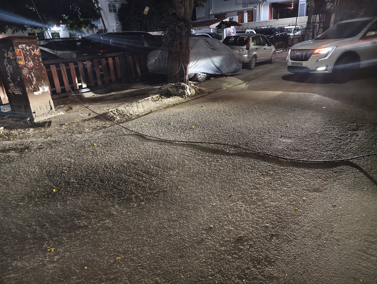 JesuValiant's tweet photo. @chennaicorp threat to all by these hanging cables, a severe menace across anna nagar and other parts of Chennai. Another low lying cable got entangled and ripped overhead carrier off.  What if a biker got his neck entangled? A block, turning of mahalingam automobiles. @chennaipolice_