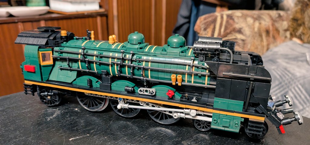 KBezbailis's tweet photo. 🚂 Orient Express update

Been on/off this one, but here's the result of about 10 hours of building - a completed locomotive.

Still got the tender, passenger car and track to go. Tender's up next.

I might need to get more space because I'm hooked. https://t.co/ENjEusB7Y5