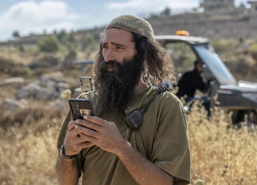 infinite_jaz's tweet photo. Amishav Melet, the settler who leads the Turmus’ayya outpost, was at the scene of today’s attack. Last October, he aimed a gun at me, made a call, then disappeared moments before a mob of settlers ambushed me. Israeli authorities know he is a menace—and he has their full support. https://t.co/crHNGgMAfA