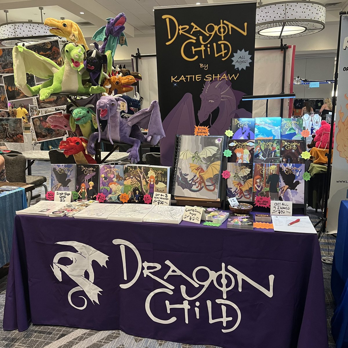 DragonChildKS's tweet photo. BayCon is here again, &amp; we’re back in the vender hall at the Santa Clara Marriott! This show goes all the way through Monday, &amp; our hall is open to the public without a badge, so stop on by and get something new to read. If you like modern fantasy comics &amp; dragons, come say hi. https://t.co/SXALhuVhQR