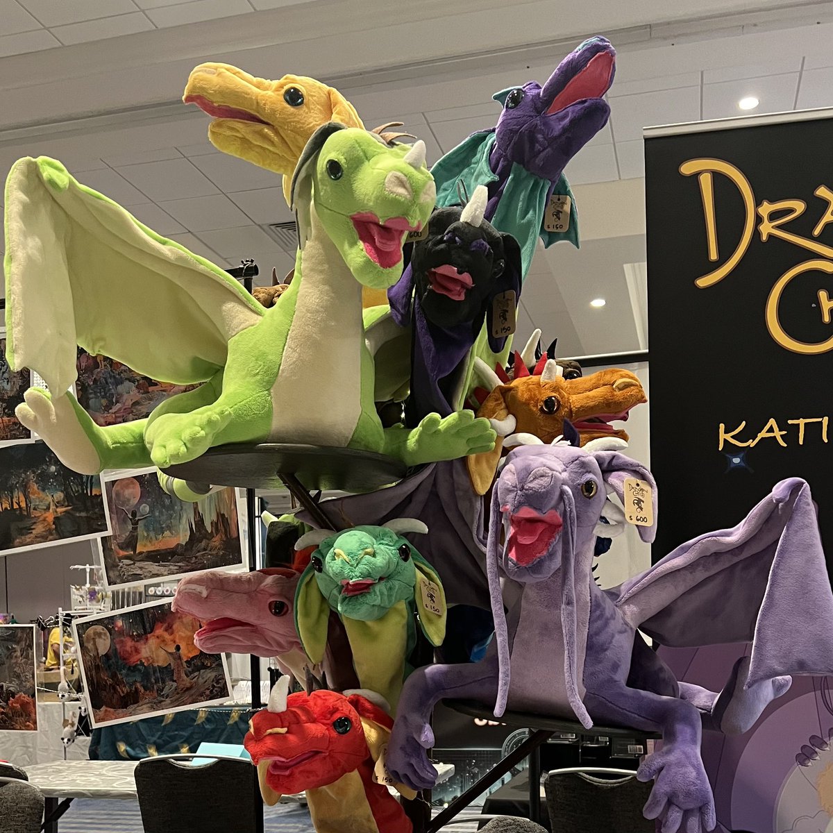 DragonChildKS's tweet photo. BayCon is here again, &amp; we’re back in the vender hall at the Santa Clara Marriott! This show goes all the way through Monday, &amp; our hall is open to the public without a badge, so stop on by and get something new to read. If you like modern fantasy comics &amp; dragons, come say hi. https://t.co/SXALhuVhQR