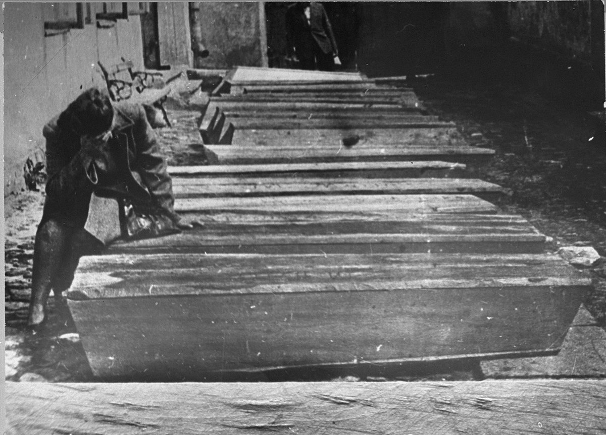 HolocaustMuseum's tweet photo. The people in these caskets survived the Holocaust—only to be killed by an antisemitic mob just over a year later. In July 1946, a group of civilians, police officers, and soldiers murdered at least 42 Jews and wounded dozens more in Kielce, Poland. https://t.co/Pzs2Bjbsw5