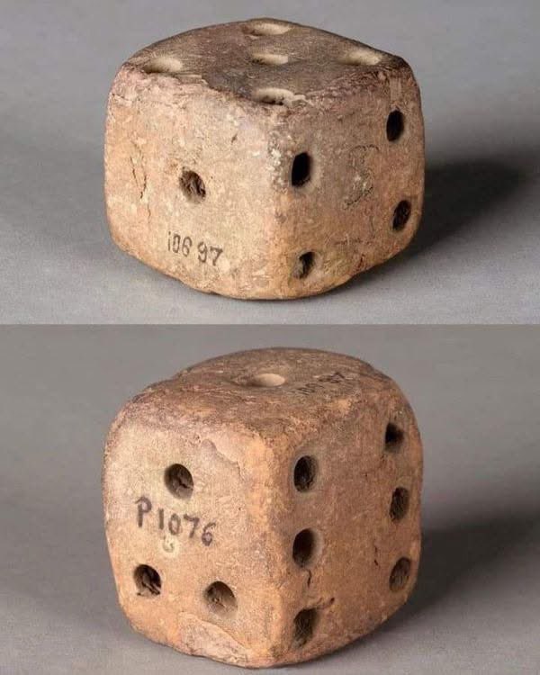 UnearthedHQ's tweet photo. The 5,000-Year-Old Dice That Proves Ancient Humans Loved Gambling Too 🎲

Buried beneath the dust of ancient ruins in Mohenjo-daro, archaeologists uncovered a small object that feels strangely familiar… a tiny terracotta dice from the mysterious Indus Valley Civilization, dating back nearly 5,000 years.

At first glance, it looks almost modern. Tiny carved dots mark each side, just like the dice people still roll today during board games, bets, and moments of pure luck. But there is something eerie about it. The arrangement of the numbers is slightly different from modern dice, hinting that the forgotten people of this ancient civilization may have played games with rules now lost to history.

Imagine the scene for a moment…

A crowded street in one of the world’s earliest cities. Oil lamps flickering in the night. Merchants, travelers, and wealthy citizens gathered around a game board. A hand reaches forward… the clay dice rolls across the floor… and everyone holds their breath waiting for fate to decide the outcome.

That exact feeling — the suspense, the hope, the fear of losing — existed thousands of years before modern civilization was born.

The dice itself is worn smooth around the edges, showing it was handled again and again by real people who once laughed, argued, celebrated victories, and cursed bad luck. It is more than an artifact. It is proof that human emotions have barely changed across 50 centuries.

What makes this discovery even more fascinating is that the people of the Indus Valley left behind no fully understood written language. Their secrets remain locked away in silence. So this tiny cube becomes one of the few surviving clues to their daily lives — a silent witness to entertainment, competition, and perhaps even ancient gambling.

And somewhere in the distant past, someone may have made a life-changing decision based on the roll of this very dice.