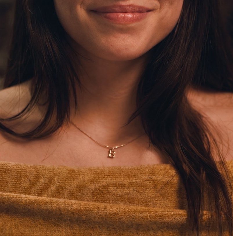clarkarchive's tweet photo. nikki wearing a "B" necklace for bear… https://t.co/7iW278KN30