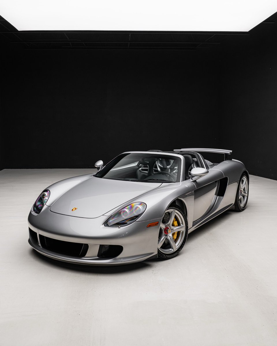 duPontREGISTRY's tweet photo. 2005 Porsche Carrera GT | Now available.

This exceptional example, chassis #855, has covered just 370 miles since new and is finished in timeless GT Silver Metallic over a Dark Grey leather interior. Accompanied by its original multi-piece luggage set, manuals, and recent service records, it represents the kind of preservation collectors dream of.

With its LMP-derived V10 screaming past 8,000 rpm and no electronic shortcuts between driver and machine, the Carrera GT remains one of the most visceral supercars ever built.

For More Info: https://t.co/XVHn2bF1FD