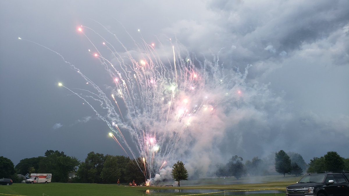 EvilJif's tweet photo. @midwestern_ope Watching the town fireworks while lightning goes off in the background. https://t.co/GPcnP2L583