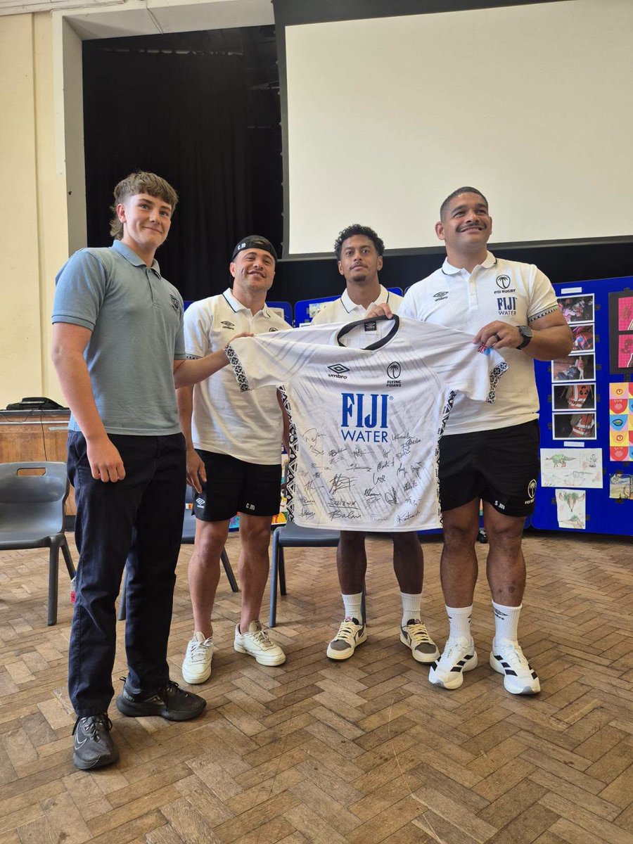 fijirugby's tweet photo. Before we step onto the Cardiff pitch this Saturday, our boys took time out to do what truly matters—connecting with the next generation of the rugby community.

FIJI Water Flying Fijians visited local youth, sharing stories, laughs, and a whole lot of heart. Because rugby isn't just about tries and tackles—it's about inspiring dreams, building lifelong friendships, and creating a family that stretches across oceans.

Vinaka vaka levu for the warm welcome. 

#FIJIWater #FlyingFijians #fijiairways #visionmotors #TappooFiji #NationsChampionship