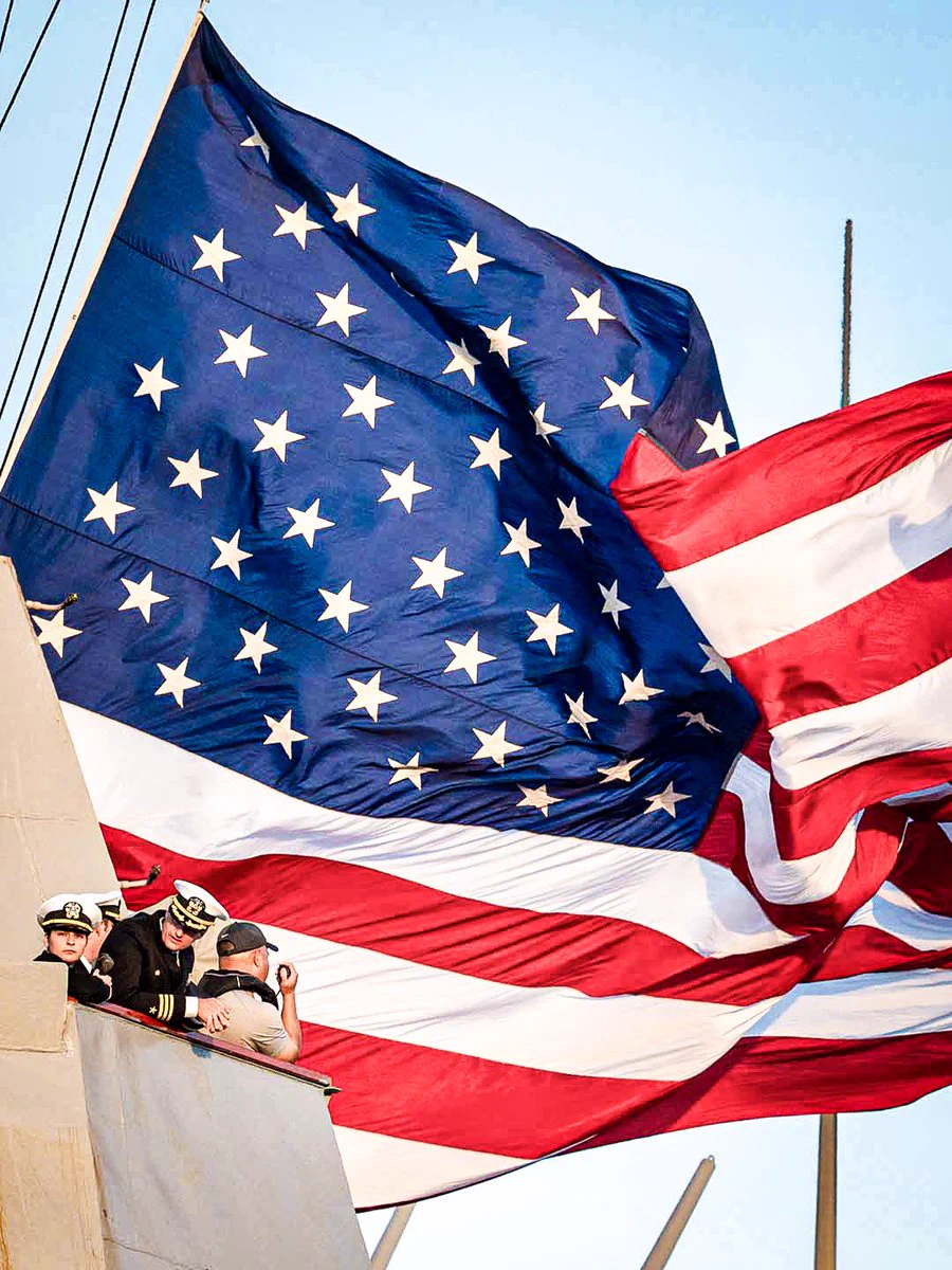 U.S. flag flying aboard a naval ship. Photo by Petty Officer 2nd Class Drace Wilson.