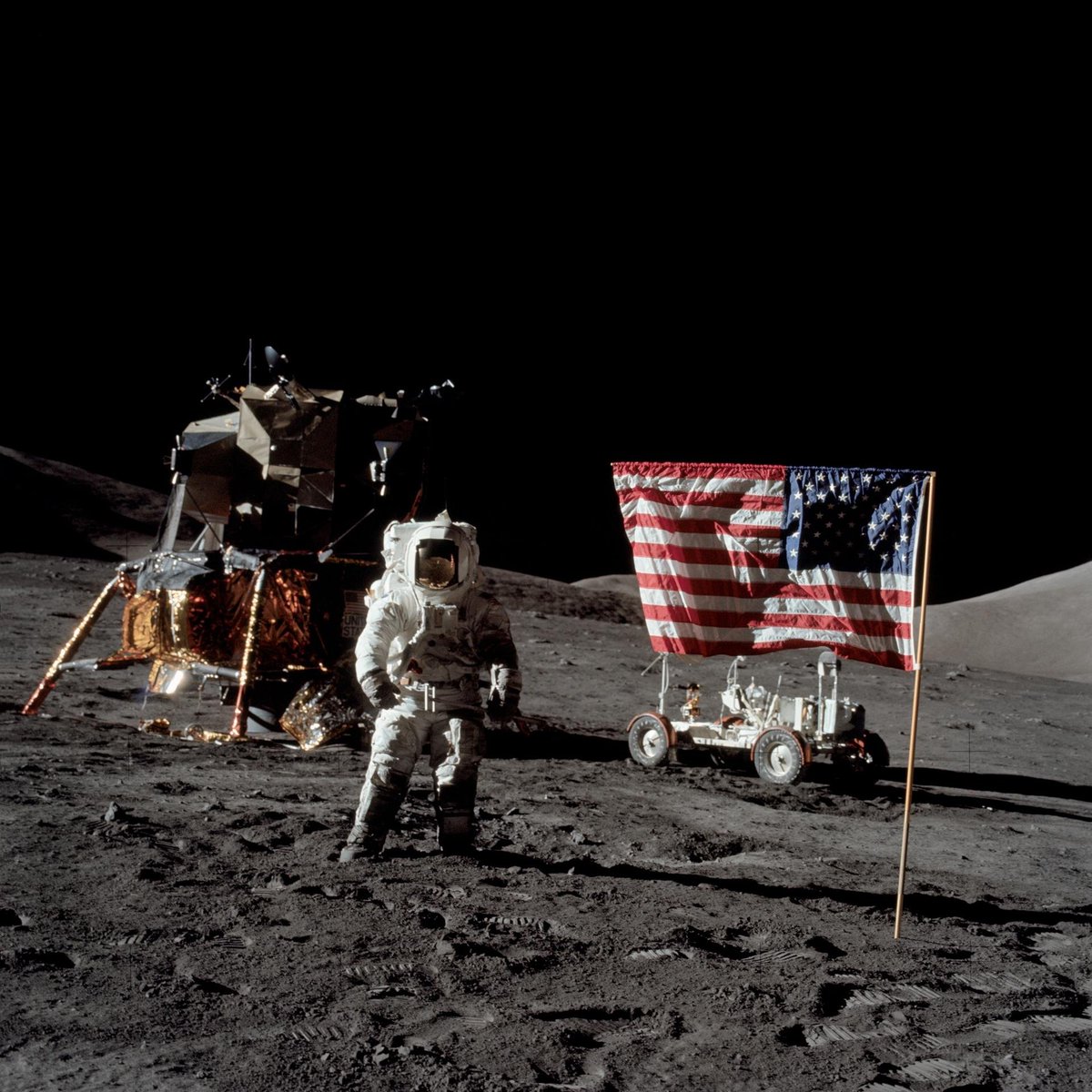 davidtphung's tweet photo. two of my favorite apollo mission photos. God bless the USA and @NASA happy 250th born day and ad astra per aspera! 🇺🇸🌕💪

photo credit link below: 
1. "Close-up view of U.S. flag deployed on Moon by Apollo 17 crew."
2. "Astronaut Harrison H. Schmitt, Apollo 17 lunar module pilot, stands near the deployed United States flag on the lunar surface during NASA’s final lunar landing mission in the Apollo series."