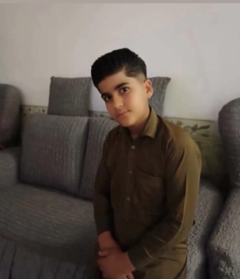 yaroomanian's tweet photo. Hozayfeh Ostakh was only 11 years old.

He left home to buy bread and never came back. Islamic Republic forces took his life. 

A Baluch child.

On January 9, the Islamic Republic shot him dead in Mashhad.

For the next 24 hours, his family searched everywhere.

Every answer was the same:

“We have no information.”

Until they found him among photographs of the dead.

His body had already been taken away without his family’s knowledge. It had been transferred to a cemetery before they even knew he was gone.

Days later, they were finally allowed to take him home.

He should have come home carrying bread. Instead, his family carried his little coffin 😭💔

#IranMassacre‌ 
#KingRezaPahlavi‌ForIran 
#جاویدشاه
