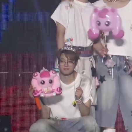 bunniewiju's tweet photo. the teamies using euijoos cheering stick and euijoo being dressed up like a princess im crying they love him so bad 😭 https://t.co/w6POGey76z