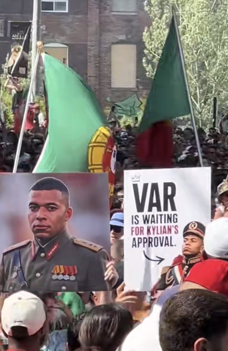 TouchlineX's tweet photo. 🚨 𝗡𝗘𝗪: Portugal fans with a Kylian Mbappé banner during their celebrations in Toronto. https://t.co/WARnmf40Fl