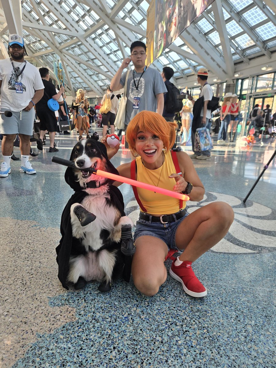 sydneythesd's tweet photo. Today I met one of my new favorite humans, fellow Dominican 🇩🇴 @Lorenaparkours! She joined the #BarkSide and promptly added me to her @Pokemon collection. @animeexpo #AX2026 https://t.co/P6TQASKcqy