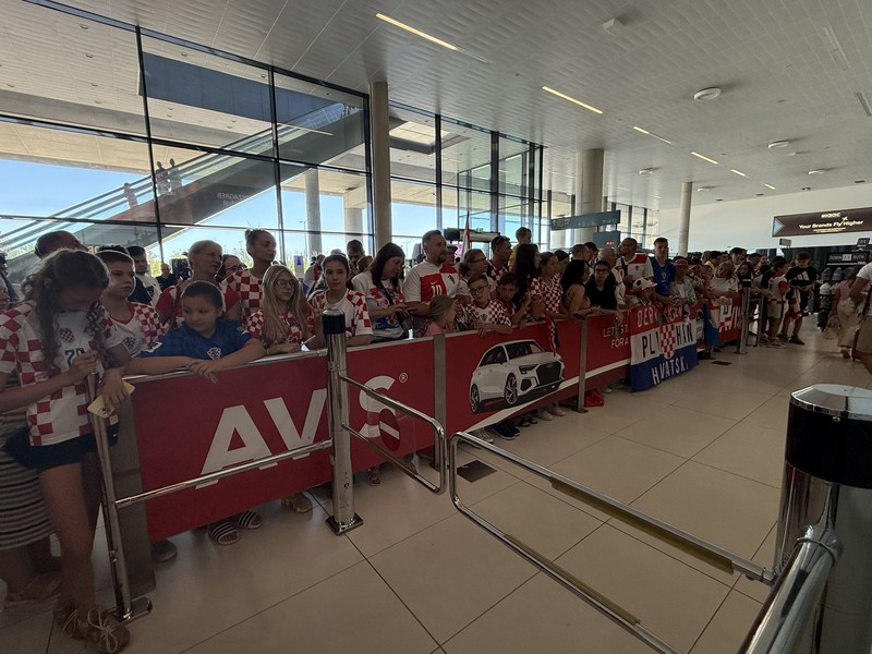 CroatiaFooty's tweet photo. ✈️ The Zagreb airport is packed with fans waiting to welcome our boys after their 2026 World Cup journey was cut short. https://t.co/ZQtIRcCy7k