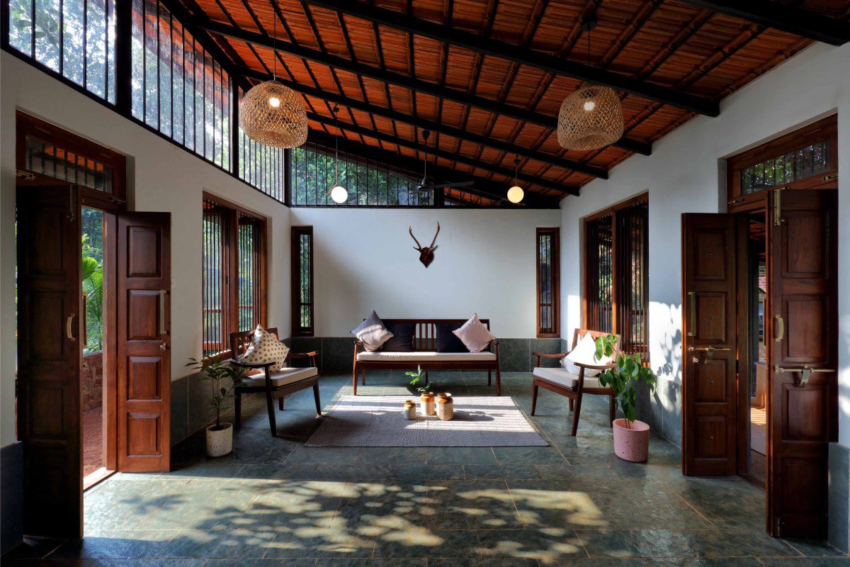 shavnyuy's tweet photo. This house in Ratnagiri, Maharashtra was built on a budget, 1,100 square feet, using laterite stone quarried within 10 kilometres of the site, Mangalore clay roof tiles, teak wood joinery and clearstory windows along the eastern wall that pull morning light through the entire living area. Cross ventilation through high ceilings and large openings means no mechanical cooling. Not a single tree on the site was cut during construction.

This is not an expensive house. It is a disciplined one.

The crude indigenous designs we have in our communities do not need to be abandoned. They need effort. When slight effort is put into laterite, into fired brick, into rammed earth, when someone takes the time to lay it properly, orient the building correctly, and open it to the right wind, the result stops looking crude and starts looking like this. The people around us cannot see how good our materials are because we have never shown them what those materials look like when they are taken seriously.

Building kilns is not a fantasy. We have the clay. We have the land. We just have not decided it matters enough yet.

There is no pride in crudeness and there is no excuse for mediocrity when the solution is already in the ground.

Ratnagiri, Maharashtra, India | Articulated Design Initiative | Photography: Vaibhav Kapadi
