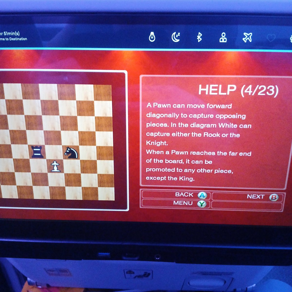 MaxyTaxy's tweet photo. I love that the Malaysian Airlines chess app:
a) has a tutorial in case you've never played before, but
b) has no difficulty slider, so only plays at master level, and 
c) has xbox controller button icons for its touchscreen interface https://t.co/3p4hGfwYWW