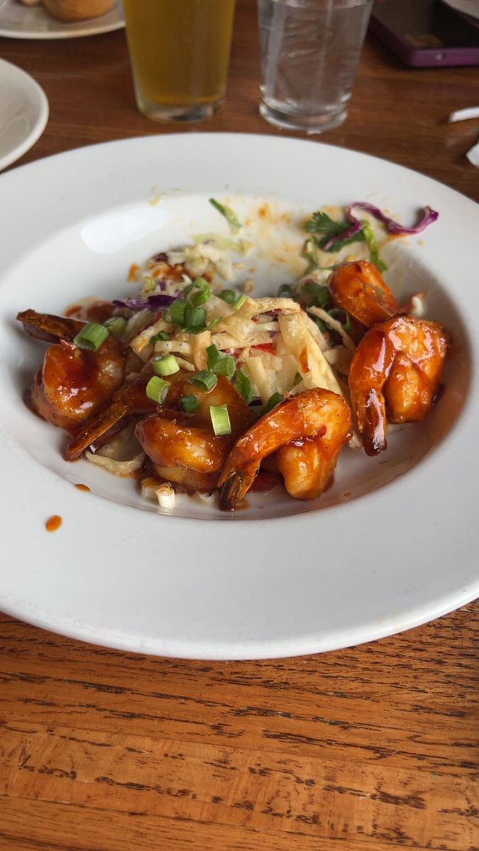 ginger_pierson's tweet photo. @altonbrown Slaw in general. I spicy Asian glazed shrimp over a sesame lime slaw yesterday for my birthday. Don’t mind it being partially eaten. I forgot to take a picture before diving in😂 https://t.co/8sJ91I3fiF