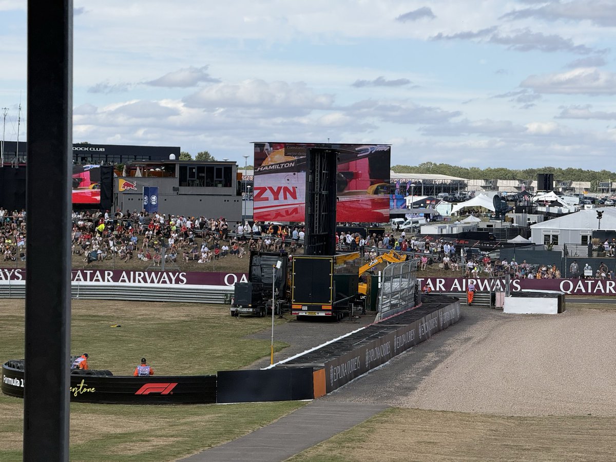 PaulSBates's tweet photo. @SilverstoneUK Are you going to move the screen at Club Corner? This was not here yesterday and you are ruining thousands of people’s enjoyment of the day.   Sort it out. https://t.co/UgGwQDeFNy