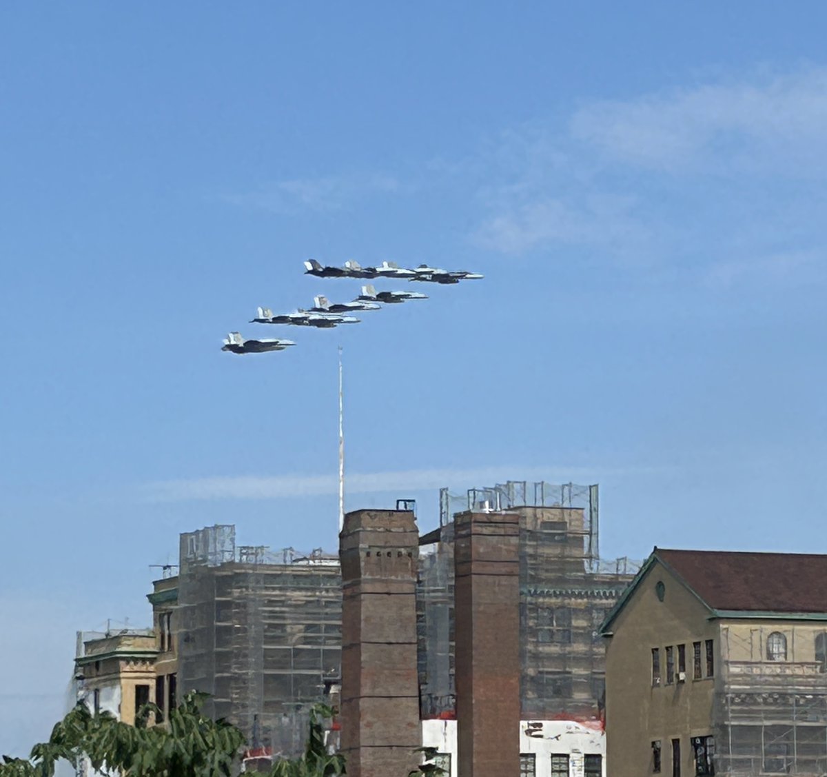 StacyHorn's tweet photo. The Blue Angels + fly up the Hudson River. The sun was shining in a way that I could not see the screen on my phone. I’m amazed any shots came out at all! My favorite was that stealth jet. Always looks like something that we reverse engineered from an alien aircraft. https://t.co/pWPRpdMvAQ