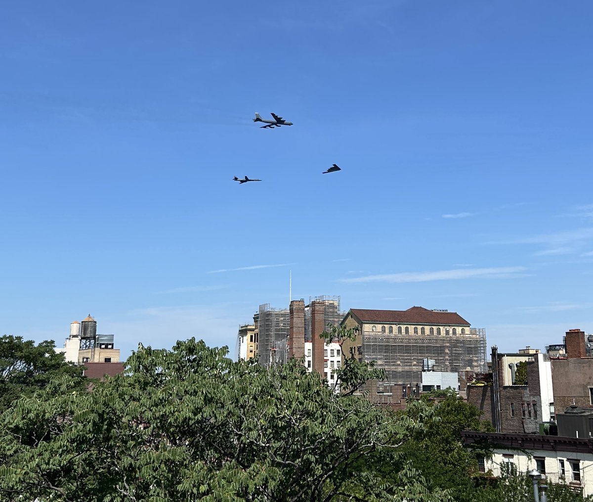 StacyHorn's tweet photo. The Blue Angels + fly up the Hudson River. The sun was shining in a way that I could not see the screen on my phone. I’m amazed any shots came out at all! My favorite was that stealth jet. Always looks like something that we reverse engineered from an alien aircraft. https://t.co/pWPRpdMvAQ