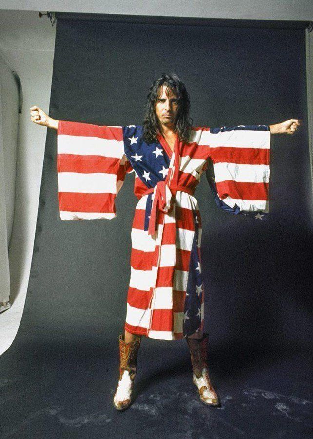 crockpics's tweet photo. Alice Cooper wearing an American Flag robe. Photo by Ethan Russell.   #Happy4thofJuly https://t.co/1LNyixiatr