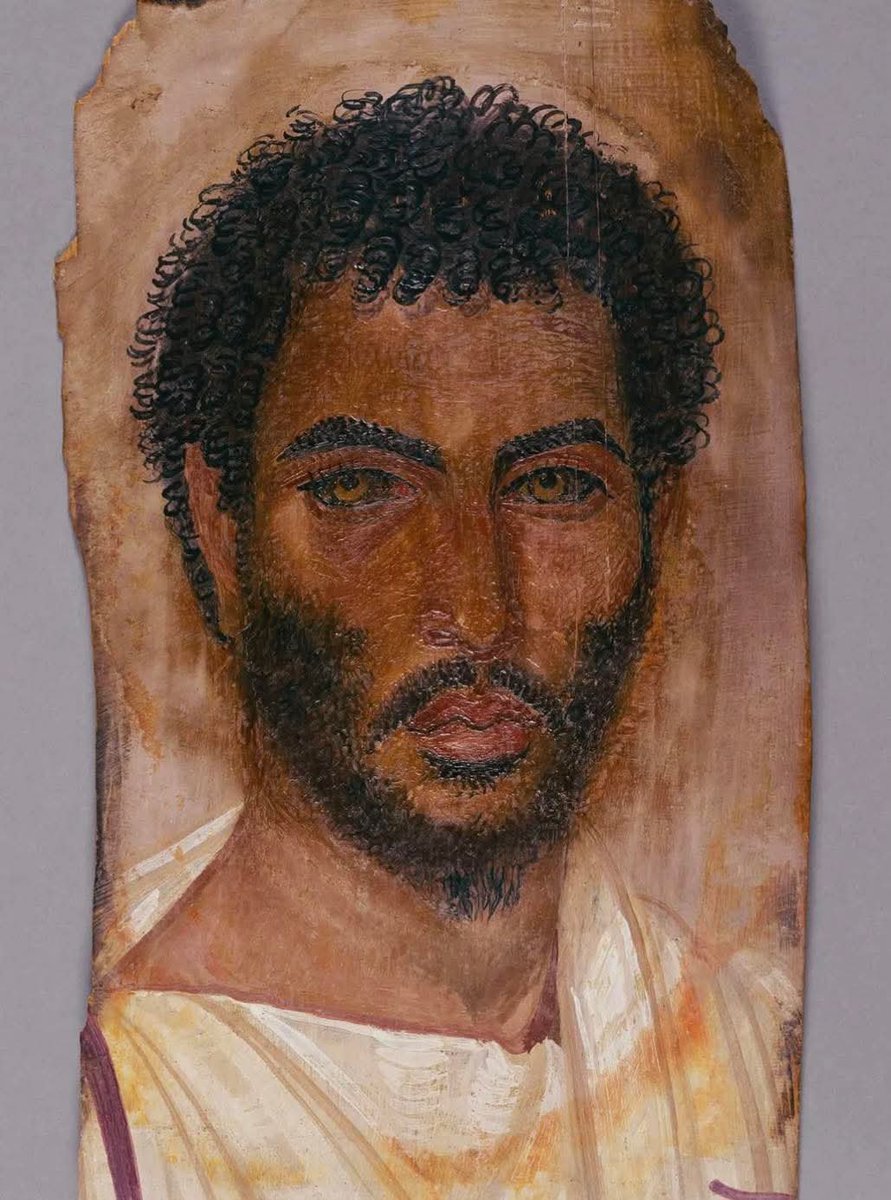 archeohistories's tweet photo. Portrait of an unidentified man that was placed over the face and upper torso of his mummy. Dated to 150–170 AD, it is painted in encaustic on a panel of linden wood, and it was originated in Roman Egypt.

This remarkable portrait belongs to a group of artworks known as the Fayum mummy portraits, a tradition that flourished in Roman Egypt between the 1st and 3rd centuries AD. Unlike the stylized depictions of faces seen in earlier Egyptian funerary art, these portraits were painted in a strikingly naturalistic style, giving us lifelike glimpses of people who lived nearly 2,000 years ago.

Painted in encaustic, a technique using hot wax mixed with pigment, the colors remain vivid even after centuries. The medium gave artists the ability to capture depth, texture, and warmth, preserving the humanity of their subjects with astonishing realism. In this particular piece, the curly hair, sharp eyebrows, and direct gaze make the man seem almost alive, as though he could step out of history and into the present.

The portrait was originally placed over the face and chest of the deceased’s mummified body, merging Egyptian burial practices with Roman artistic sensibilities. These works represent more than individual likenesses—they reflect the cultural blending of Greek, Roman, and Egyptian traditions in a society at the crossroads of the ancient Mediterranean world.

What makes the Fayum portraits so moving is the intimacy they provide. Unlike statues of emperors or gods, these images show ordinary people: merchants, soldiers, mothers, and children. Each one is a reminder that behind the ruins and relics of antiquity were lives full of stories, emotions, and identities. This man’s name may be lost to time, but his face survives as one of history’s most hauntingly personal echoes.

#archaeohistories