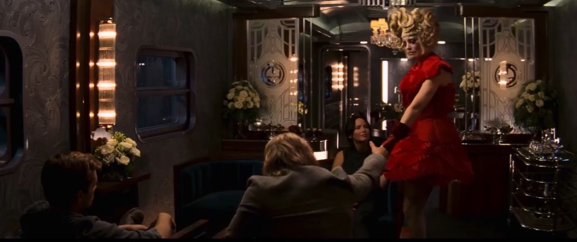 TR13NKET's tweet photo. haymitch abernathy and effie trinket had been holding hands for 25 years now https://t.co/J2IaamDvVk