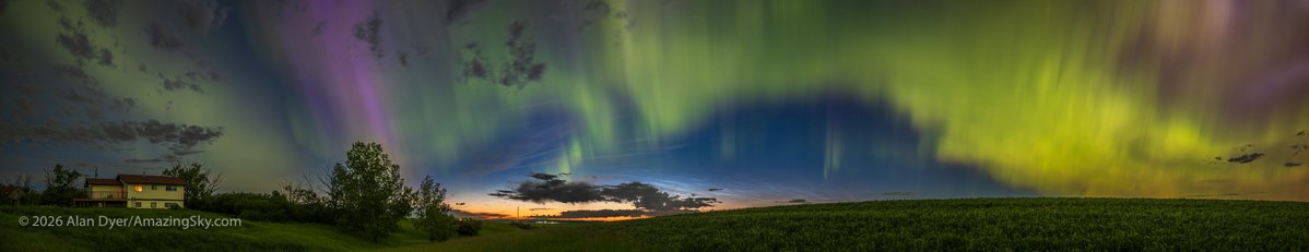 amazingskyguy's tweet photo. It was quite the sky show! This is panorama from home in Alberta of the Kp7-level display of aurora borealis on July 3/4, 2026, along with a showing of bright noctilucent clouds on the northern horizon. They appear behind local dark tropospheric clouds. https://t.co/pcSY0Ox7TS