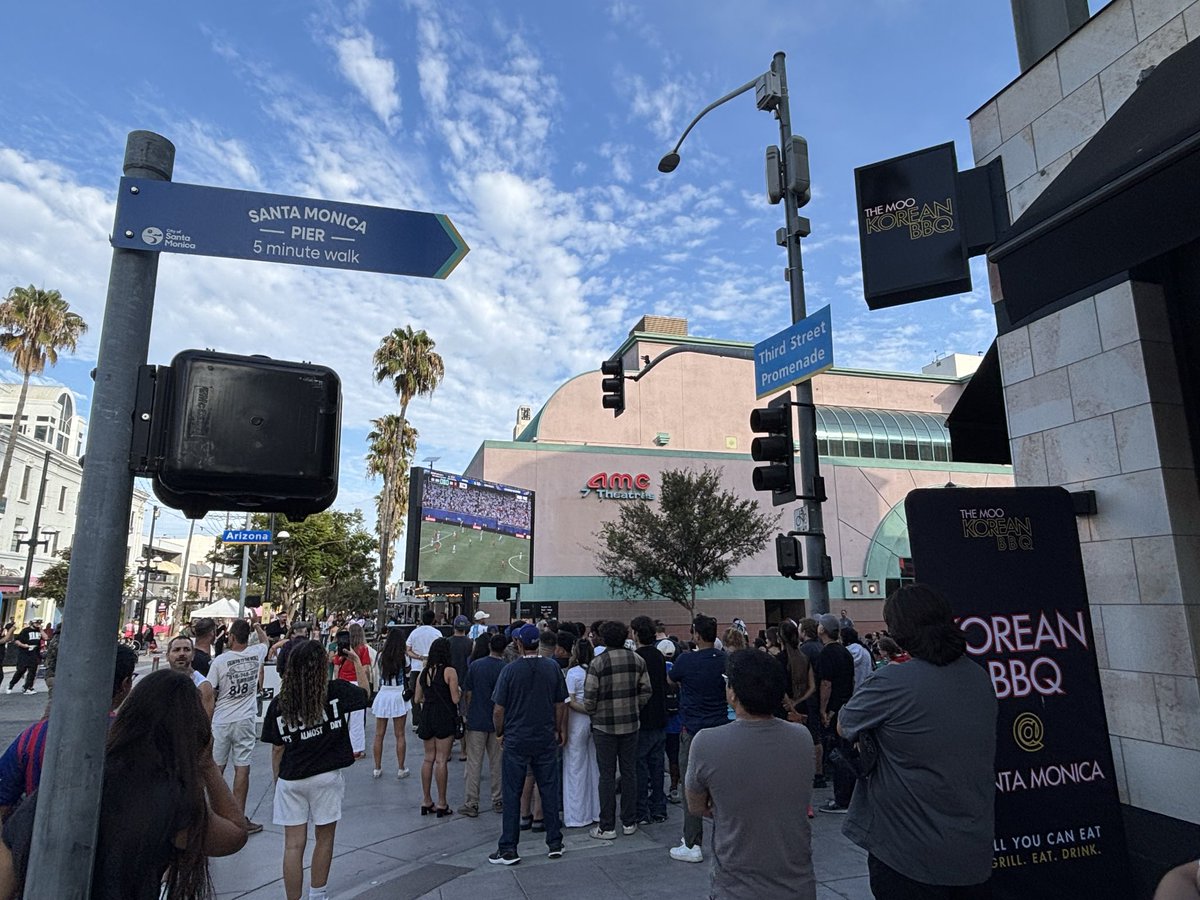 Cassy_Horton's tweet photo. Third Street Promenade entertainment zone in Santa Monica seems like a success. I haven’t seen it this active since before COVID. Lots of retail vacancy to fill, but w some intentional programming people are out. DTLA needs this, let’s make it happen @cd14losangeles @MayorOfLA! https://t.co/jw6Pb4mvDY