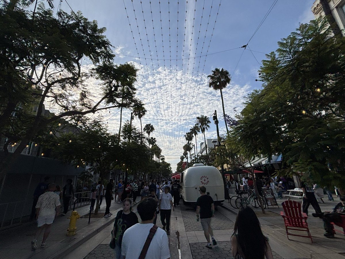 Cassy_Horton's tweet photo. Third Street Promenade entertainment zone in Santa Monica seems like a success. I haven’t seen it this active since before COVID. Lots of retail vacancy to fill, but w some intentional programming people are out. DTLA needs this, let’s make it happen @cd14losangeles @MayorOfLA! https://t.co/jw6Pb4mvDY