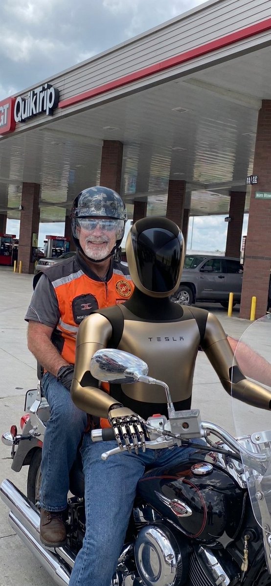 Romans152's tweet photo. @Tesla_Optimus Mine took me for a ride on my motorcycle today. What a blast we had! https://t.co/noCfHdaBJP