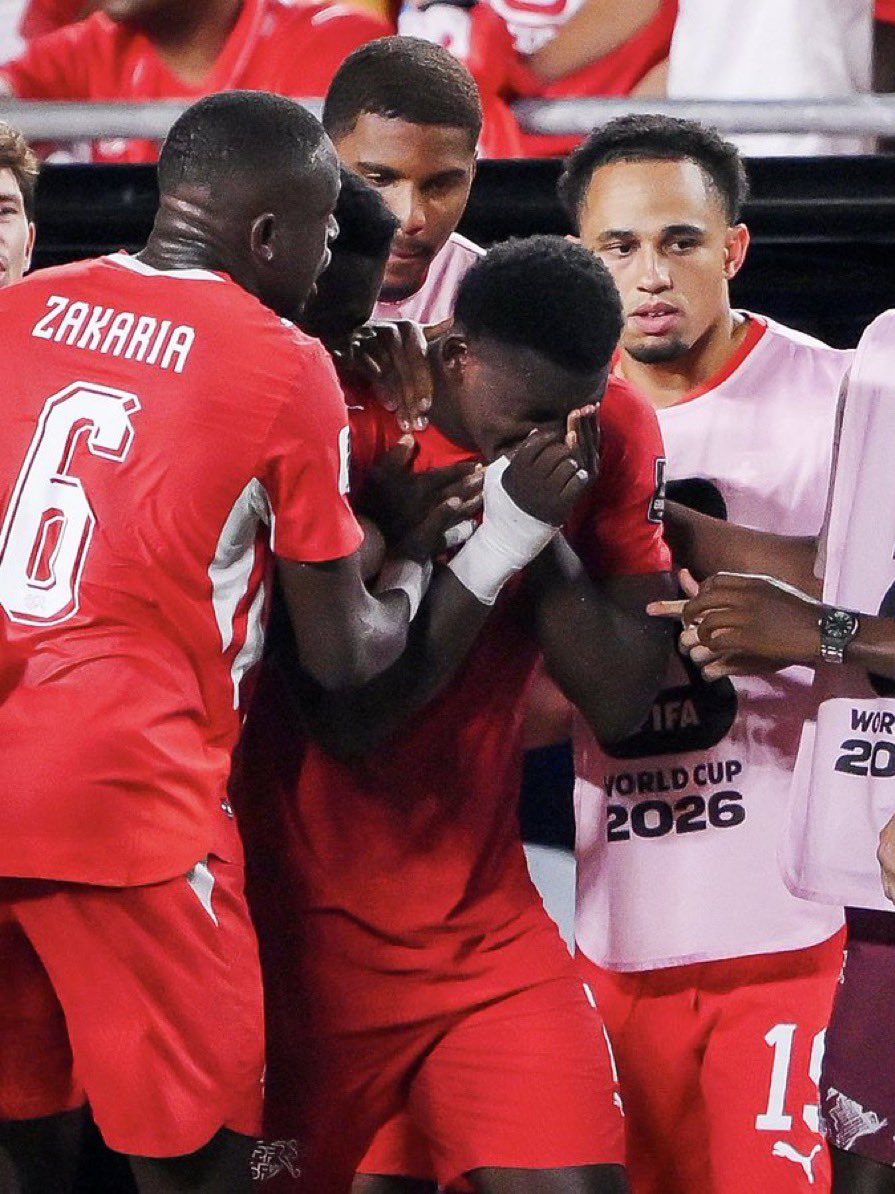 markklfc's tweet photo. Xherdan Shaqiri on Breel Embolo after his red card against Argentina.

🗣️ “I walked straight over to Breel after the referee showed the red card, and I’ve never seen him like that. He kept saying, ‘I didn’t dive… I didn’t dive.’ He wasn’t arguing because he wanted attention he was devastated because he genuinely believed he’d been punished for something he didn’t do.”

“People sitting at home will slow the replay down and make their own judgments, but they don’t know what it’s feels like in that split second. Breel felt contact on his leg, lost his balance and went down naturally. That’s football. To immediately label him a cheat and send him off is unbelievably harsh.”

“The referee didn’t just give him a second yellow he destroyed his World Cup in one whistle. Imagine fighting your entire life to play on the biggest stage, only for your tournament to end with a decision that will be debated for years. That’s heartbreaking.”

“Breel was in tears in the dressing room. Not because he was afraid of criticism, but because he believed he had let his teammates and the people of Switzerland down. I told him, ‘Lift your head. You have nothing to apologise for.’ The only people who should be explaining themselves tonight are the officials.”

“I’m furious because football should never be decided like this. Argentina are a great team—they don’t need a controversial red card to beat anyone. Let the players decide the match. Instead, we’re all talking about a refereeing decision instead of the football. That’s a disgrace.”

“People can accuse Breel of diving all they want, but I know the man. He’s one of the most honest, strongest and hardest-working players I’ve ever shared a dressing room with. He doesn’t throw himself to the ground looking for sympathy. He fights. That’s why seeing him walk off with tears in his eyes hurt every single one of us.”

“This defeat will hurt, but what hurts even more is knowing we weren’t allowed to fight on equal terms. Breel didn’t deserve to leave the World Cup like this. Switzerland deserved better. Football deserved better.”