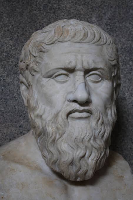 histories_arch's tweet photo. Plato, one of history's greatest philosophers, why did he often express his ideas not in his own words, but through the voice of his teacher Socrates?

With Socrates' execution, philosophy was dragged from the streets of Athens to the courtroom. Plato, to compensate for this loss, brought his teacher back to life; but this was no ordinary commemoration. Socrates now spoke, questioned, and judged through Plato's pen. This choice was both a profound act of loyalty and a silent manifesto against injustice. Because Socrates was dead, but the questioning mind was not. By keeping him alive in his works, Plato declared that philosophy could not be executed.

Socrates' endless questions, irony, and "knowing that he didn't know" attitude provided Plato with a unique stage for explaining philosophy. Instead of a dry system, the reader found themselves in the midst of a lively debate taking place in the streets of Athens. Ideas were born, clashed, and matured along with the characters. Thus, philosophy ceased to be the pursuit of the elite and became a journey that everyone could undertake in their minds. The fact that Socrates wrote nothing down made his legacy even more meaningful; Plato, by writing down his teacher's thoughts, made them permanent and open to discussion.

The deepest reason, however, was that Socrates was the ideal philosopher for Plato. He explained difficult subjects such as the theory of Forms, the understanding of the soul, and justice through Socrates' simple, courageous, and moral personality. He used Socrates not as a mask, but as a mirror. Thus, he both showed respect to his teacher and conveyed the message: "Philosophy is not merely thinking; it is rejecting an unexamined life." Therefore, Socrates continued to live on in the conscience and minds of humanity even after his death.

#archaeohistories
