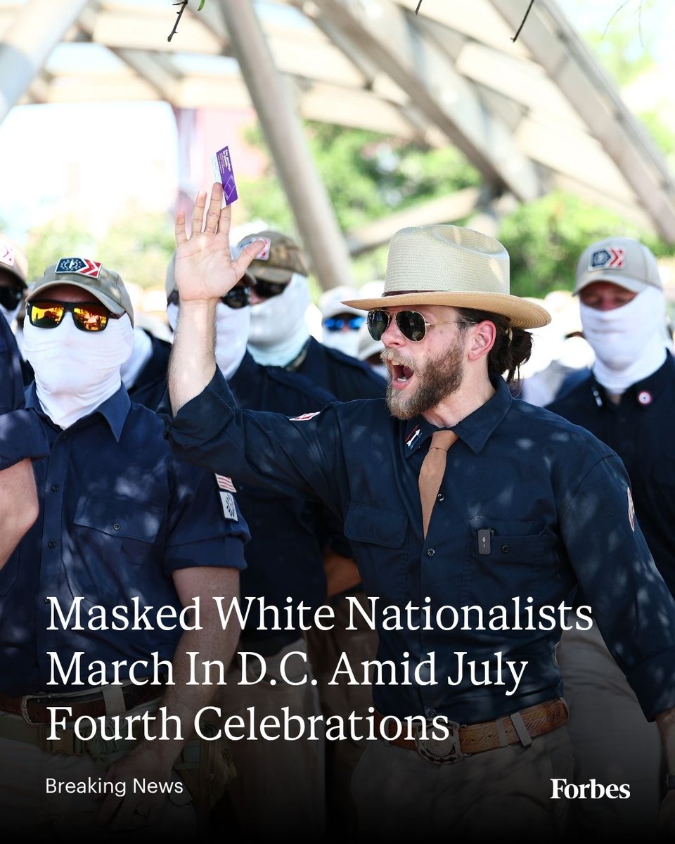Forbes's tweet photo. Masked members of white nationalist organization Patriot Front marched upon Washington, D.C., on Saturday, carrying Confederate flags and upside down American flags amid Fourth of July celebrations in the Capitol. https://t.co/wg8k0czGA0 (Photo: Finn Gomez via Getty Images) https://t.co/4A7gQkbtyV