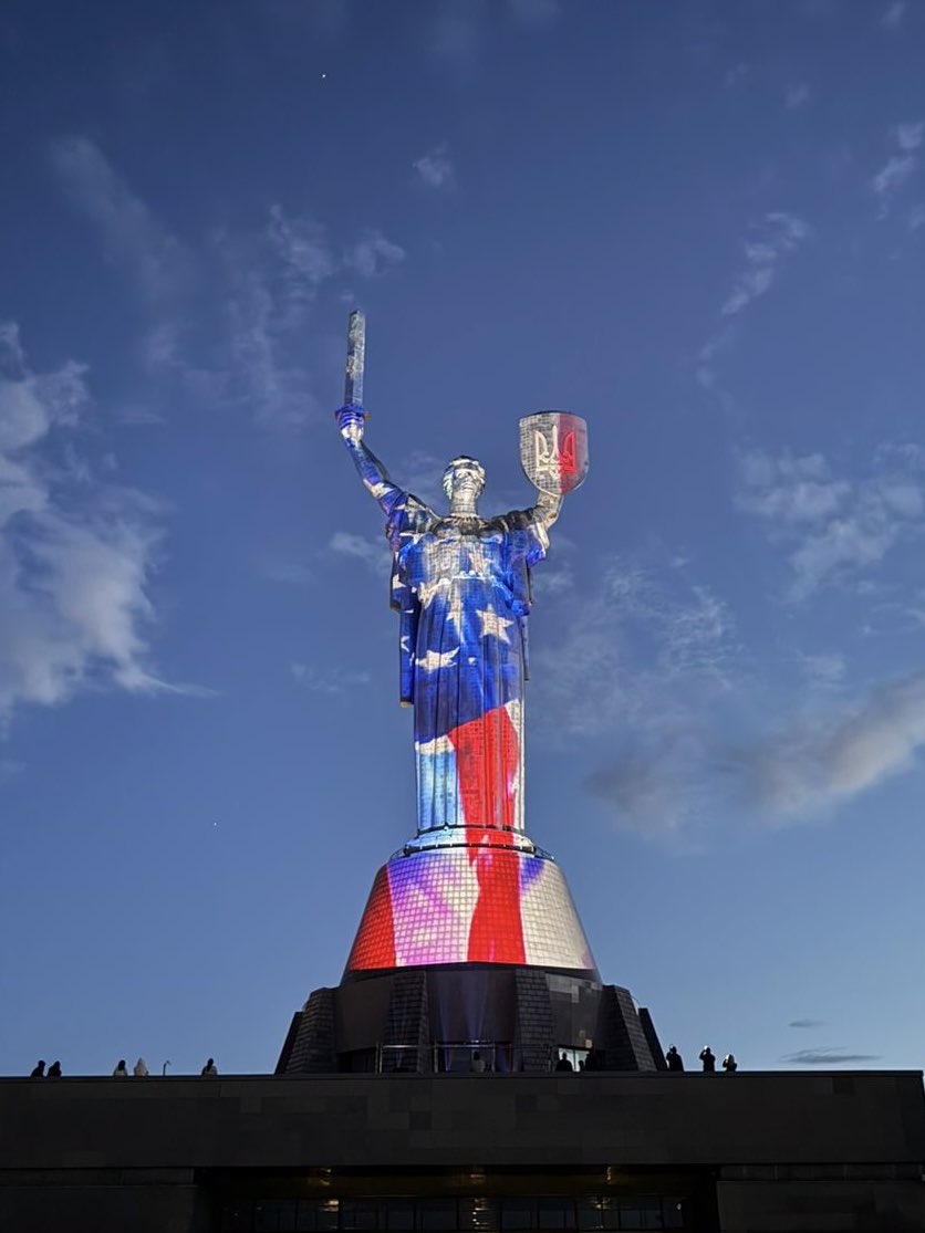 sentdefender's tweet photo. Mother Ukraine, the most iconic statue in the Ukrainian capital of Kyiv, bathed in the colors of the American Flag, red, white and blue, in celebration of the Fourth of July and 250th Anniversary of the United States. https://t.co/o6Z3Yc1But