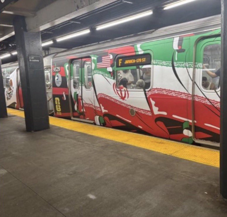 ConstitustionX's tweet photo. 🚨 TREASON IN BROAD DAYLIGHT ON AMERICA’S 250TH BIRTHDAY 🚨
While our nation celebrates 250 years of freedom, NYC Mayor Zohran Mamdani’s MTA just wrapped an entire subway train in the Iranian REGIME’S flag — flying it proudly through the streets of New York like a victory banner for our enemies!
This isn’t a “marketing stunt.” This is an outright betrayal. Honoring the regime that chants “Death to America” while American flags should be waving everywhere.
How much deeper does the rot go? When did our own government start siding with terrorist regimes over its own people?
This is TREASON at the highest level.
SHARE if you want this investigated NOW. Fire the officials responsible. America First — or get the hell out!
#TreasonInNYC #IranianFlagOnMTA #MamdaniExposed #July4thBetrayal #America250