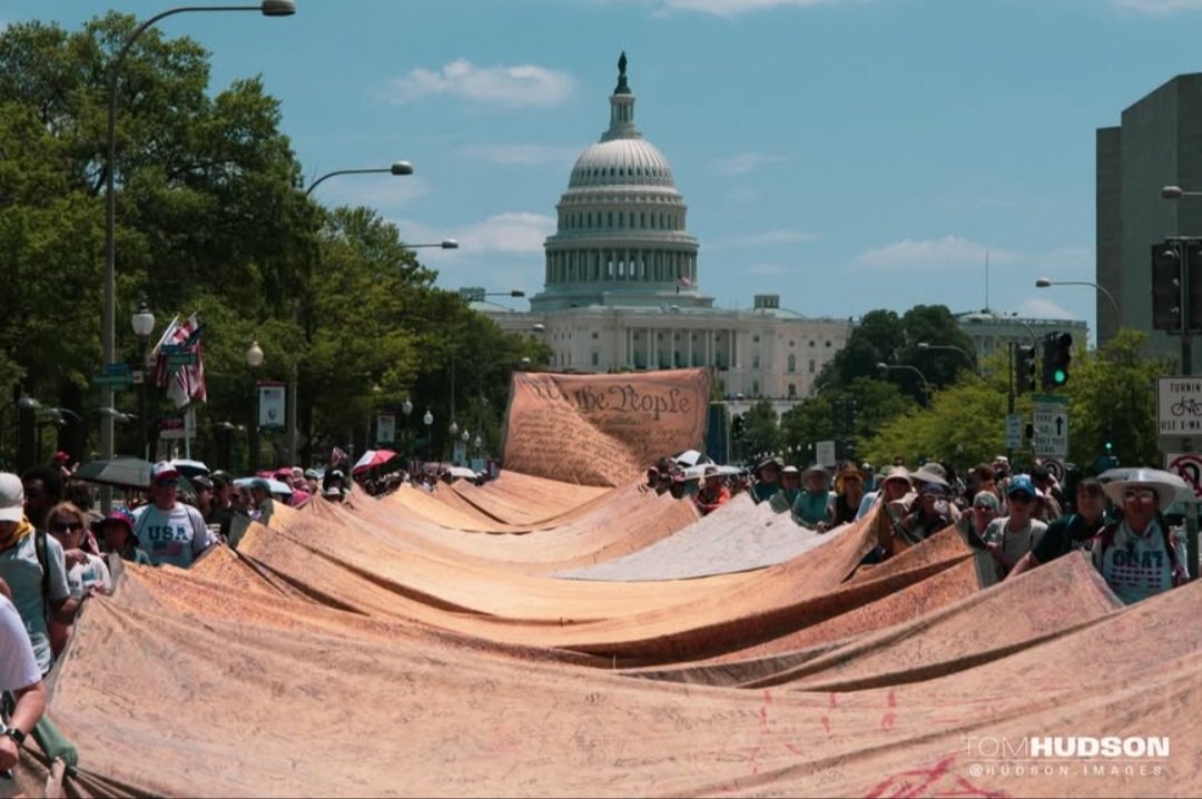 AzPetrich's tweet photo. It's currently 101°F (38C) right now with a heat index of 115°F (46C) and protesters have converged near the National Mall and are  marchIng down Pennsylvania Ave. with a several-hundred foot long facsimile of the Constitution, calling for the impeachment and removal of Trump. https://t.co/ki7MbJp29Y
