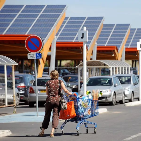 giveashitnature's tweet photo. France passed a law requiring solar panels on every parking lot larger than 1,500 square meters.

The law took effect in July 2023. Large lots over 10,000 square meters must be 50 percent covered by solar canopies by July 2026. Smaller lots have until 2028. 

Exemptions exist for lots with genuine technical or environmental constraints, and for lots already shaded by trees.

France didn't just issue a mandate and walk away. The 2024 Finance Law introduced a Green Industry Tax Credit covering 25 to 40 percent of eligible solar investment costs. 

Small businesses largely won't be impacted by the law. It more targets shopping centers, supermarkets, stadiums, and large commercial lots, not Le P'tit Bistrot.

Critics said businesses would just get rid of their parking lots. Carrefour, France's largest supermarket chain, is actually enthusiastically installing solar canopies across 350 stores, covering 180,000 parking spaces. It's expected to generate 450 gigawatt hours of power annually, enough to run the stores themselves, and it's using the canopies as a selling point - shaded parking makes stores more attractive to customers.

The projected energy output is expected to be up to 11 gigawatts, equivalent to roughly 10 nuclear reactors, without using a single additional acre of land. 

The US has approximately 800 million parking spaces, most of them uncovered asphalt baking in direct sunlight. Should we do this too?
