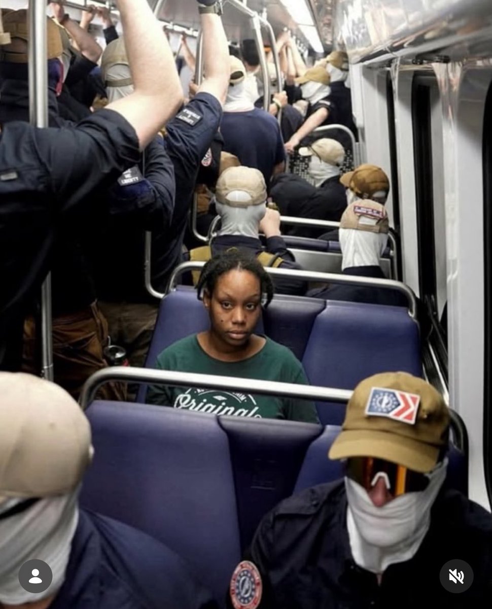 ShaneClaiborne's tweet photo. Photo of a courageous woman on a train full of white supremacists with masks, emboldened by this regime. 

This is America. 2026. 
250 years. 

But hate will not win. 

Photo by: Orr Photo/Reuters https://t.co/EzGjj5Lhyb