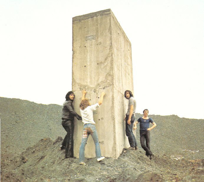 crockpics's tweet photo. The Who during an impromptu roadside photoshoot that would ultimately yield the iconic cover art for 'Who's Next,' Celebrated rock photographer Ethan Russell was actually driving the band back to London after a show in Sunderland when they looked out the window and saw these bizarre, giant concrete structures jutting out of the coal waste slagheaps at Easington Colliery.

Because Stanley Kubrick's 2001: A Space Odyssey was a massive cultural phenomenon at the time, the band immediately saw these pillars as a hilarious, industrial version of the movie's alien monolith. Russell pulled the car over, and the guys started fooling around, climbing the sides, and posing for the lens. Just moments after this specific shutter clicked, they decided to pull a legendary prank that resulted in the final, iconic cover photo for their absolute masterpiece album, Who's Next. It is a spectacular behind-the-scenes look at four rock icons just acting like kids in a wasteland, completely unaware they were making art history.