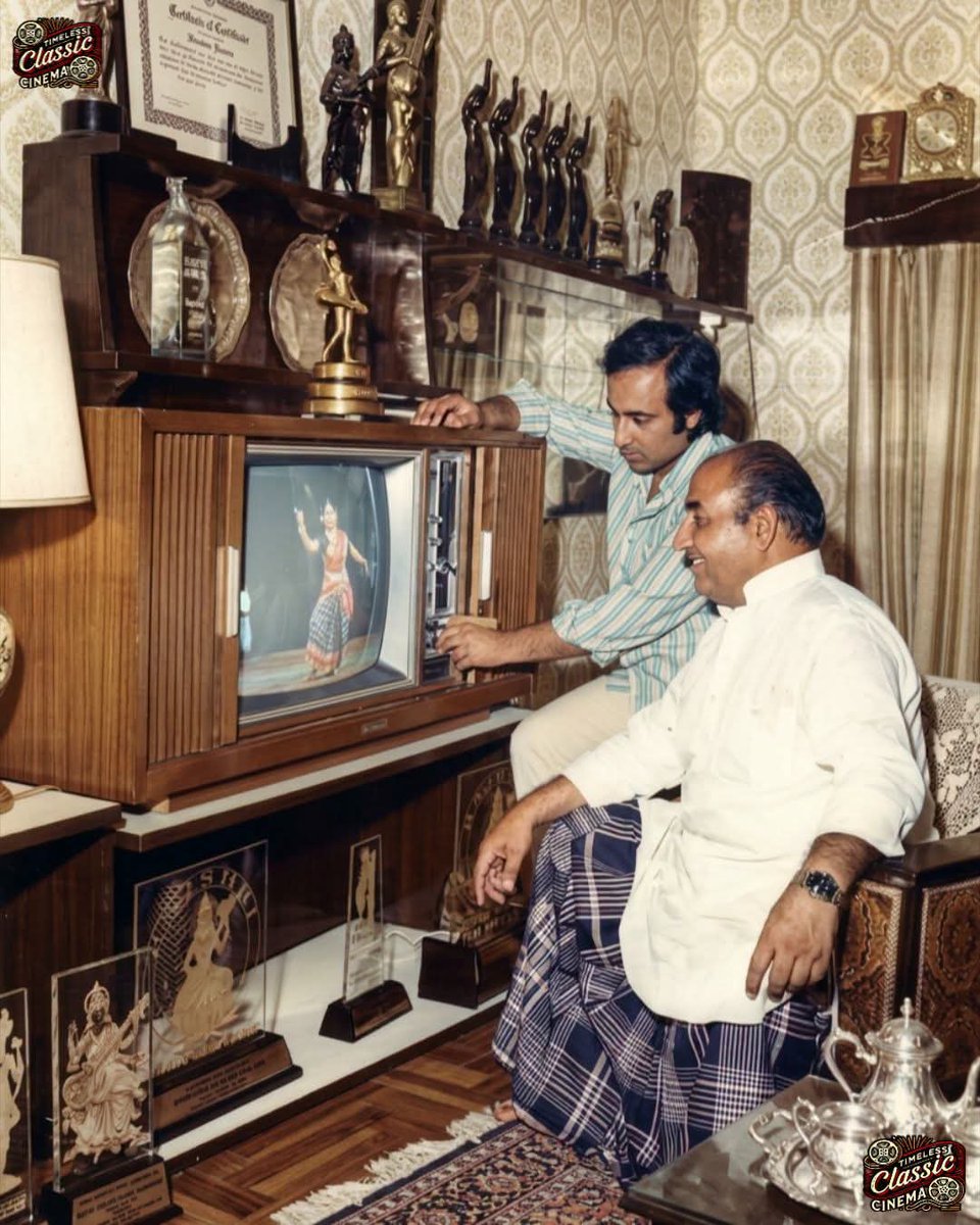 AdhirSinha's tweet photo. late 1970s at Mohammed Rafi’s Mumbai home, Rafi Villa. His son, Khalid Rafi, is showing him a newly installed vintage shutter-style television while Rafi Sahib smiles with quiet delight. Behind him, a showcase displays his Filmfare Awards and musical trophies, reflecting his extraordinary legacy. The image beautifully highlights the legendary singer’s humility, simplicity, and deep love for family.
Who had this type of b/w tv?
I had one, Weston brand.