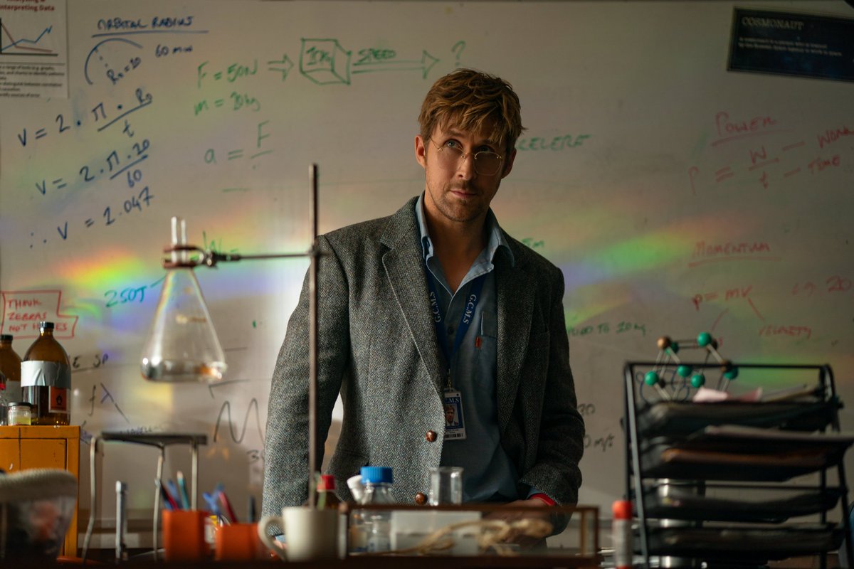 jammmatello's tweet photo. looking at this photo and falling in love with phm's prop and set design all over again.  all the details on the whiteboard??  the equation used for finding centrifugal acceleration?? the little card defining cosmonaut?? soo much love went into this film https://t.co/jhKgDLZQE3