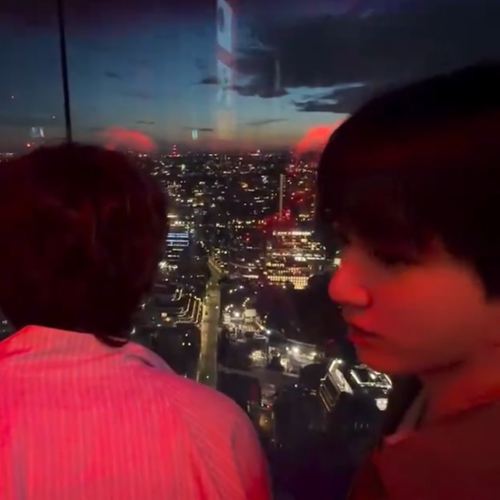 sugarbabykoo's tweet photo. taehyung is so real a literal skyline behind him but jungkooks ginormous boba eyes and squishy cheeks being better and cuter than any view a city could ever offer https://t.co/ahH0wHsa9V