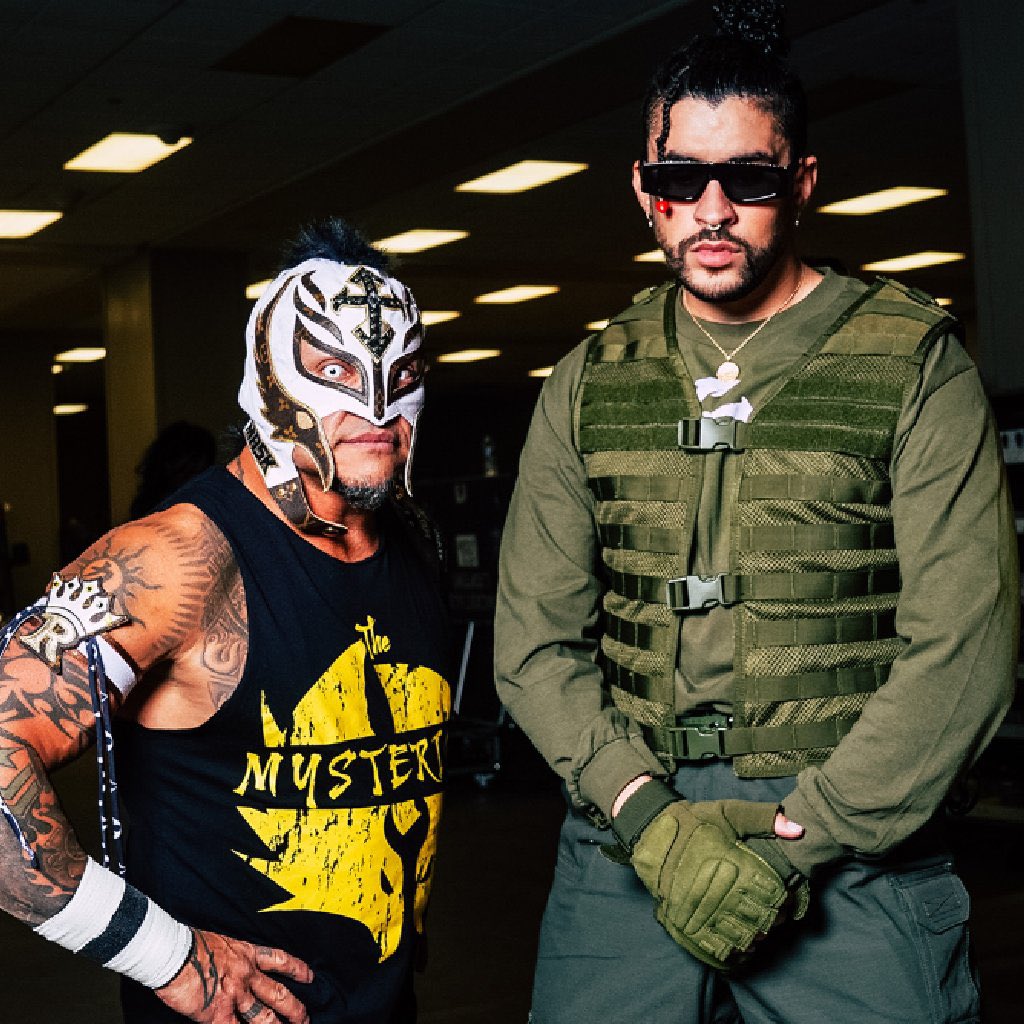 WrestlePurists's tweet photo. Rey Mysterio and JBL’s commentary exchange about Bad Bunny during AAA tonight:

JBL: “Now that we have Damian Priest, can we get Bad Bunny also in AAA?”

Rey: “We’re working on that as well.”

JBL: “Awesome. I remember when they had a football game right in the middle of his concert last year.”

#AAAenFOX